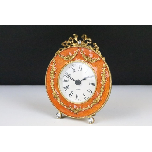 195 - Ornate Gilt Metal and Orange Enamelled Table Clock, 12cm high