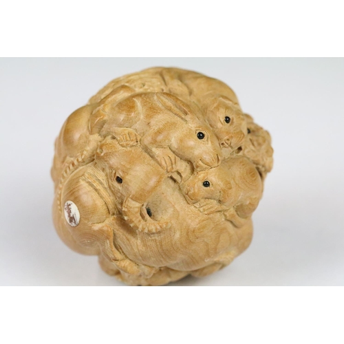 199 - An oriental boxwood spherical carving of animals to include rats, horse, ram, monkey...etc.. signed ... 