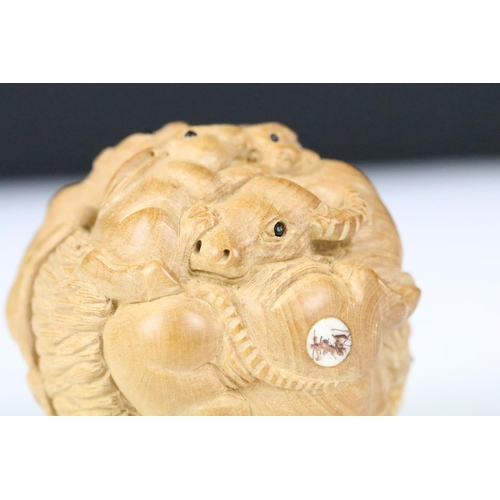 199 - An oriental boxwood spherical carving of animals to include rats, horse, ram, monkey...etc.. signed ... 