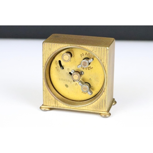 204 - An early 20th century swiss made Zenith travel clock complete with travel case.