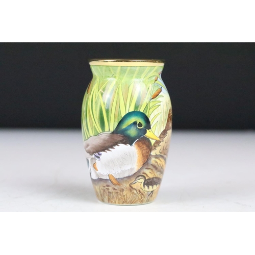 209 - A Moorcroft two piece set to include an enamel box and an enamel vase both with Mallard decoration, ... 