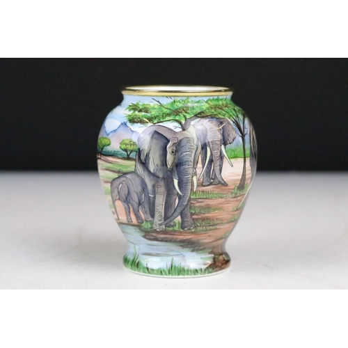 210 - A Moorcroft enamel vase with Elephant decoration, limited edition no.124 0f 200 together with a Moor... 