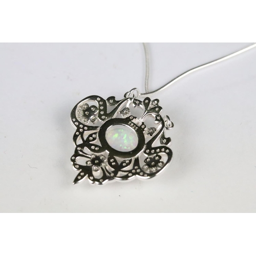 219 - Silver and CZ Pendant with central opal panel