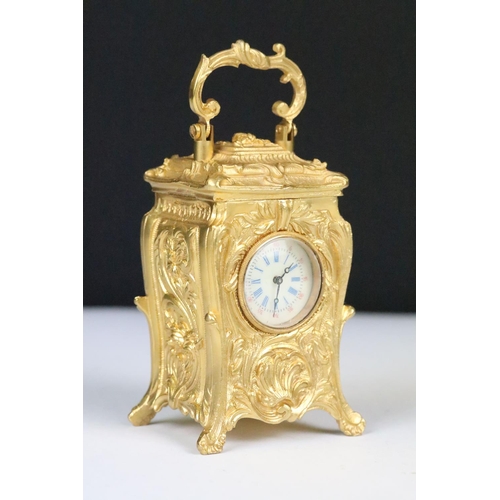 254 - Miniature Carriage Clock in a Rococo style case with key