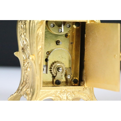 254 - Miniature Carriage Clock in a Rococo style case with key