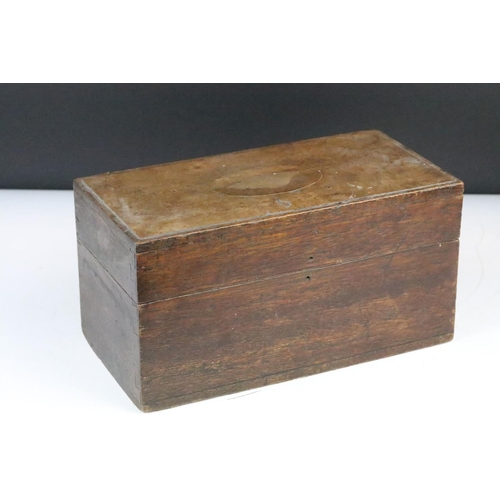 267 - A turned wooden chess set within an antique wooden box, queen stands approx 9cm in height.