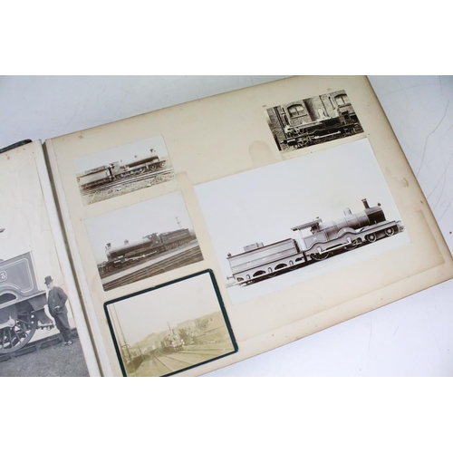 410 - An early 20th century photograph album containing black & white photographs of steam trains.