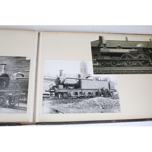 410 - An early 20th century photograph album containing black & white photographs of steam trains.