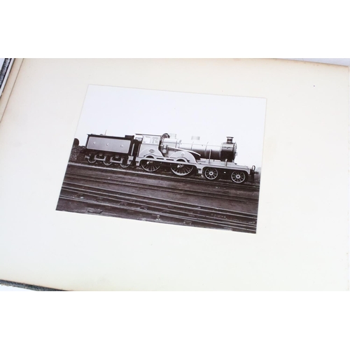 410 - An early 20th century photograph album containing black & white photographs of steam trains.