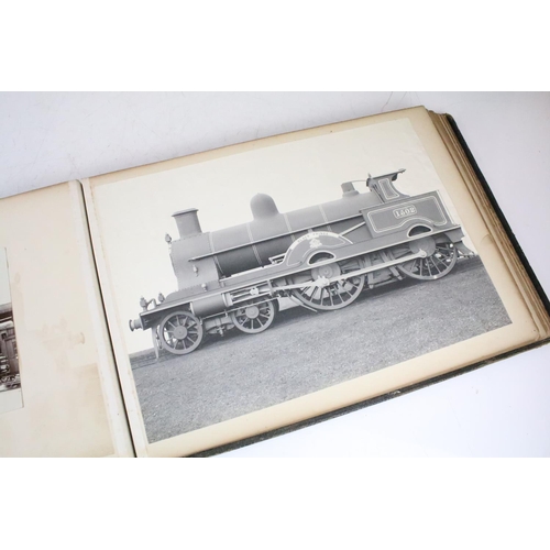 410 - An early 20th century photograph album containing black & white photographs of steam trains.