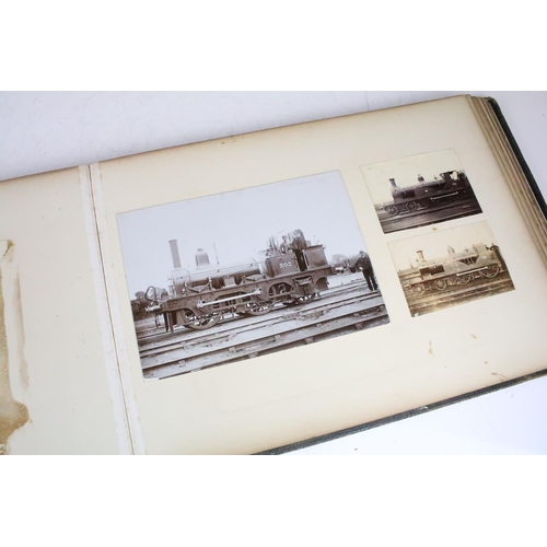 410 - An early 20th century photograph album containing black & white photographs of steam trains.