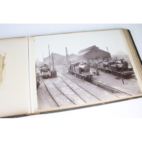 410 - An early 20th century photograph album containing black & white photographs of steam trains.