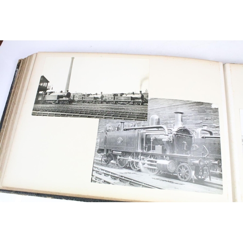 410 - An early 20th century photograph album containing black & white photographs of steam trains.