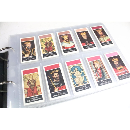 411 - A large collection of cigarette cards contained within four albums to include Players, Black Cat and... 