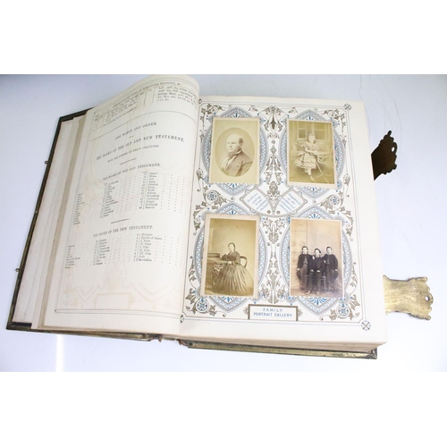 412 - An antique Brown's Family Bible with numerous colour illustrations and a family portrait gallery of ... 