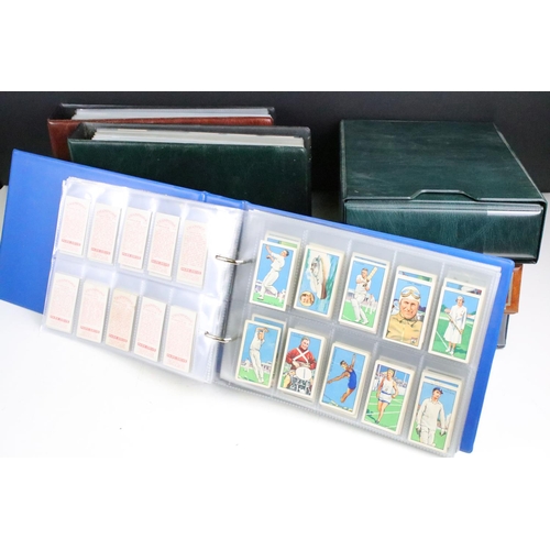 414 - A large collection of cigarette cards within six albums to include Wills, Players, Black Cat, Chings... 