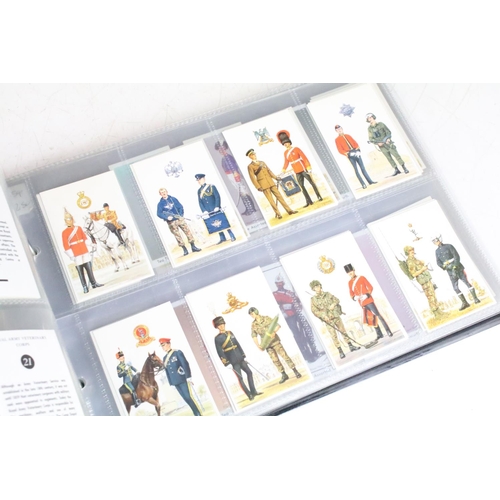 415 - A collection of cigarette cards contained within albums to include Players, Black Cat and Gallaher e... 