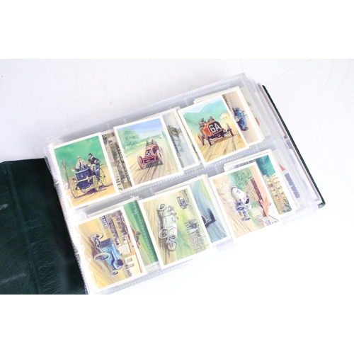 415 - A collection of cigarette cards contained within albums to include Players, Black Cat and Gallaher e... 