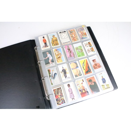 415 - A collection of cigarette cards contained within albums to include Players, Black Cat and Gallaher e... 