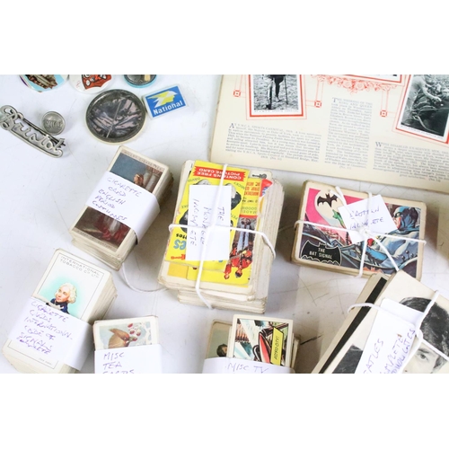 425 - A box of mixed collectables to include cigarette cards, 1960's / 1970's button badges to include The... 