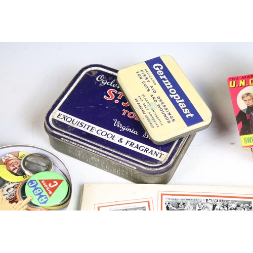 425 - A box of mixed collectables to include cigarette cards, 1960's / 1970's button badges to include The... 