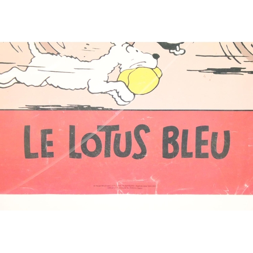 142 - Advertising Poster - Tintin ‘ Le Lotus Bleu ‘ featuring Tintin riding a bicycle and Snowy running al... 