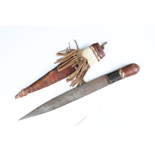 285 - A vintage Kenyan Maasai warriors knife together with a small example.