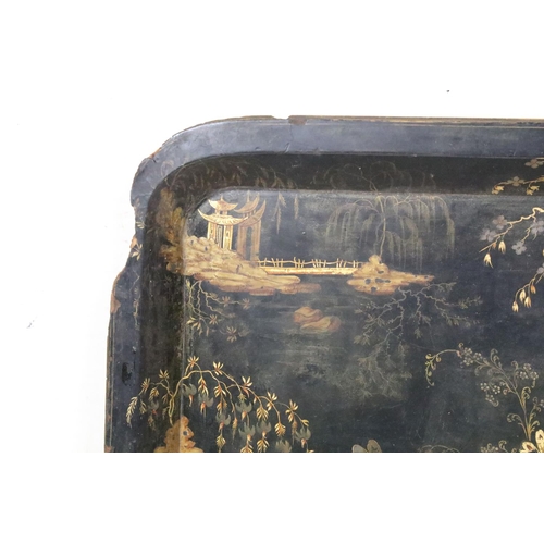 379A - Large Chinoiserie black & gilt lacquered rectangular tray decorated with blossoming trees & pagoda s... 