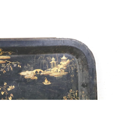 379A - Large Chinoiserie black & gilt lacquered rectangular tray decorated with blossoming trees & pagoda s... 