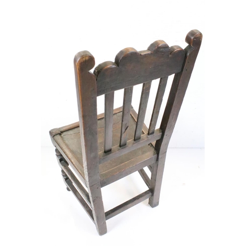 570 - Four similar 17th or 18th century Country Oak Chairs, three with scrolling carved top rails and all ... 