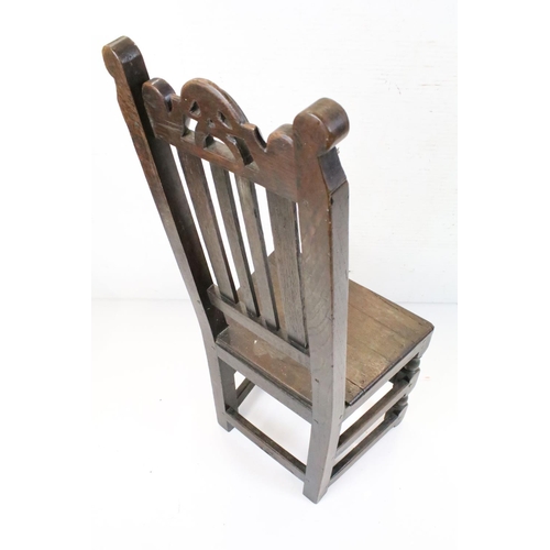 570 - Four similar 17th or 18th century Country Oak Chairs, three with scrolling carved top rails and all ... 