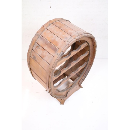 573 - Wooden Coopered Wine Rack of oval form, 65cm high x 44cm wide x 24cm deep