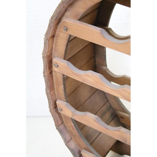 573 - Wooden Coopered Wine Rack of oval form, 65cm high x 44cm wide x 24cm deep