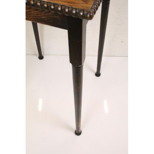 628 - Arts and Crafts Oak Square Table with parquet top and beaded edge raised on turned tapering legs, 73... 