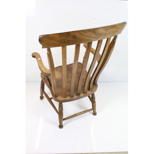 630 - Farmhouse Lathe Back Elm Seated Windsor Elbow Chair, 106cm high x 60cm wide together with Ercol Elbo... 