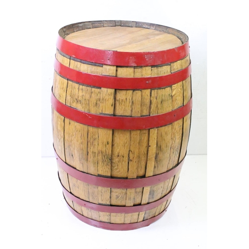 582 - Large Coopered Golden Oak Barrel or Cask, the metal bands painted red, 86cm high x 59cm diameter