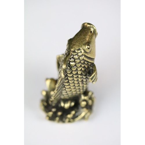 193 - A Chinese brass ornamental figure in the form of a Koi Carp, stands approx 6cm in height.