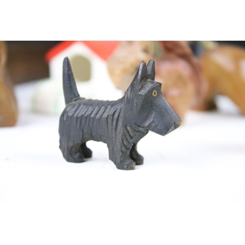 289 - A collection of carved wooden dog ornaments to include a good selection of Scottie / Scotts terriers... 