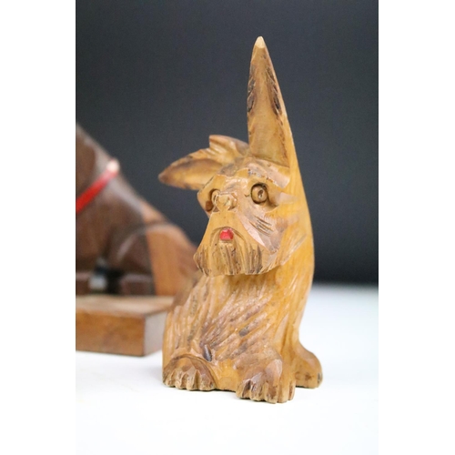 289 - A collection of carved wooden dog ornaments to include a good selection of Scottie / Scotts terriers... 