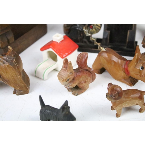 289 - A collection of carved wooden dog ornaments to include a good selection of Scottie / Scotts terriers... 