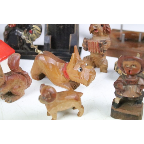 289 - A collection of carved wooden dog ornaments to include a good selection of Scottie / Scotts terriers... 