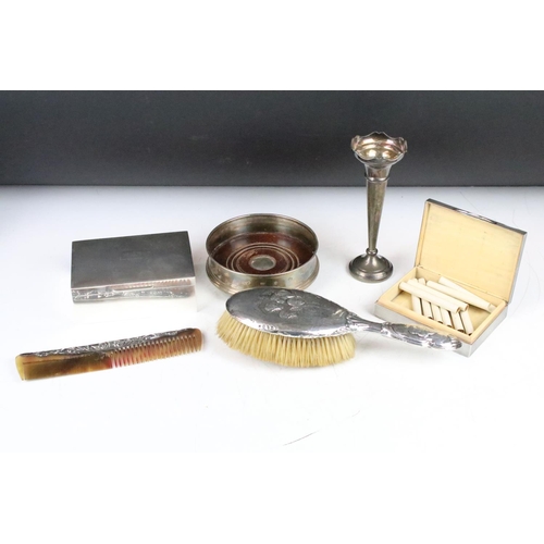 294 - A collection of hallmarked sterling silver to include two cigarette boxes, bottle coaster, bud vase,... 