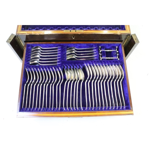 299 - A two drawer canteen of silver plated cutlery together with a hallmarked sterling silver hand mirror... 