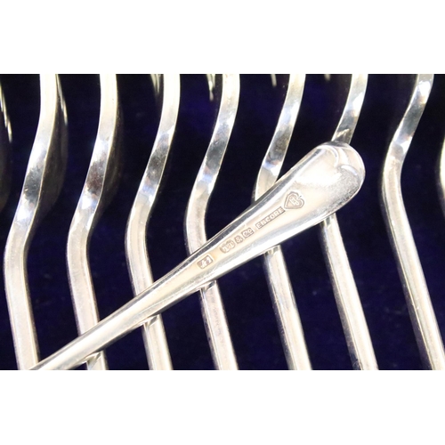 299 - A two drawer canteen of silver plated cutlery together with a hallmarked sterling silver hand mirror... 