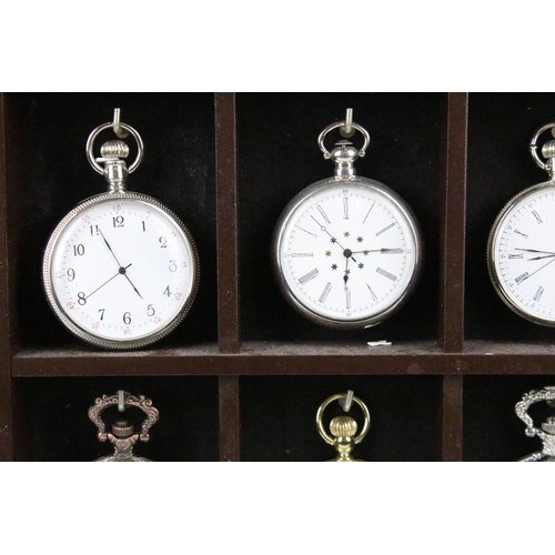 300 - A collection of fifteen contemporary pocket watches contained within a wooden wall mounted display c... 