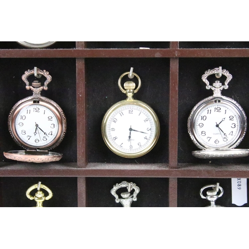 300 - A collection of fifteen contemporary pocket watches contained within a wooden wall mounted display c... 