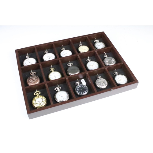 300 - A collection of fifteen contemporary pocket watches contained within a wooden wall mounted display c... 