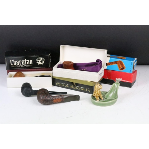 310 - A collection of boxed and unboxed smokers pipes to include Charatan examples together with a Wade ce... 