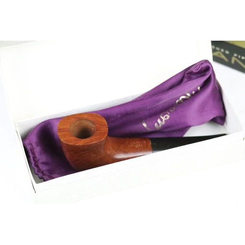 310 - A collection of boxed and unboxed smokers pipes to include Charatan examples together with a Wade ce... 