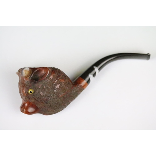 311 - Two novelty wooden smokers pipes with carved bowls in the form of animals.